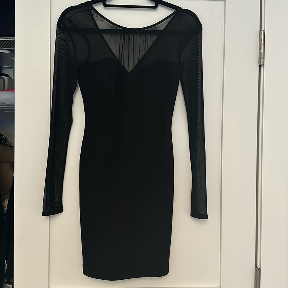 NWT BCBGeneration black bodycon dress with sheer sleeves and neckline, size 0